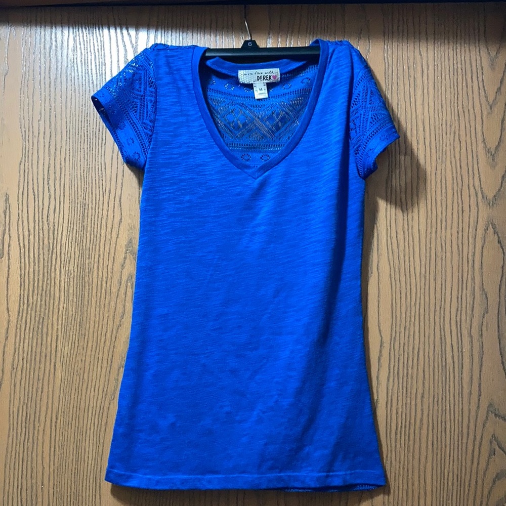 Blue shirt with see thru back. Size medium